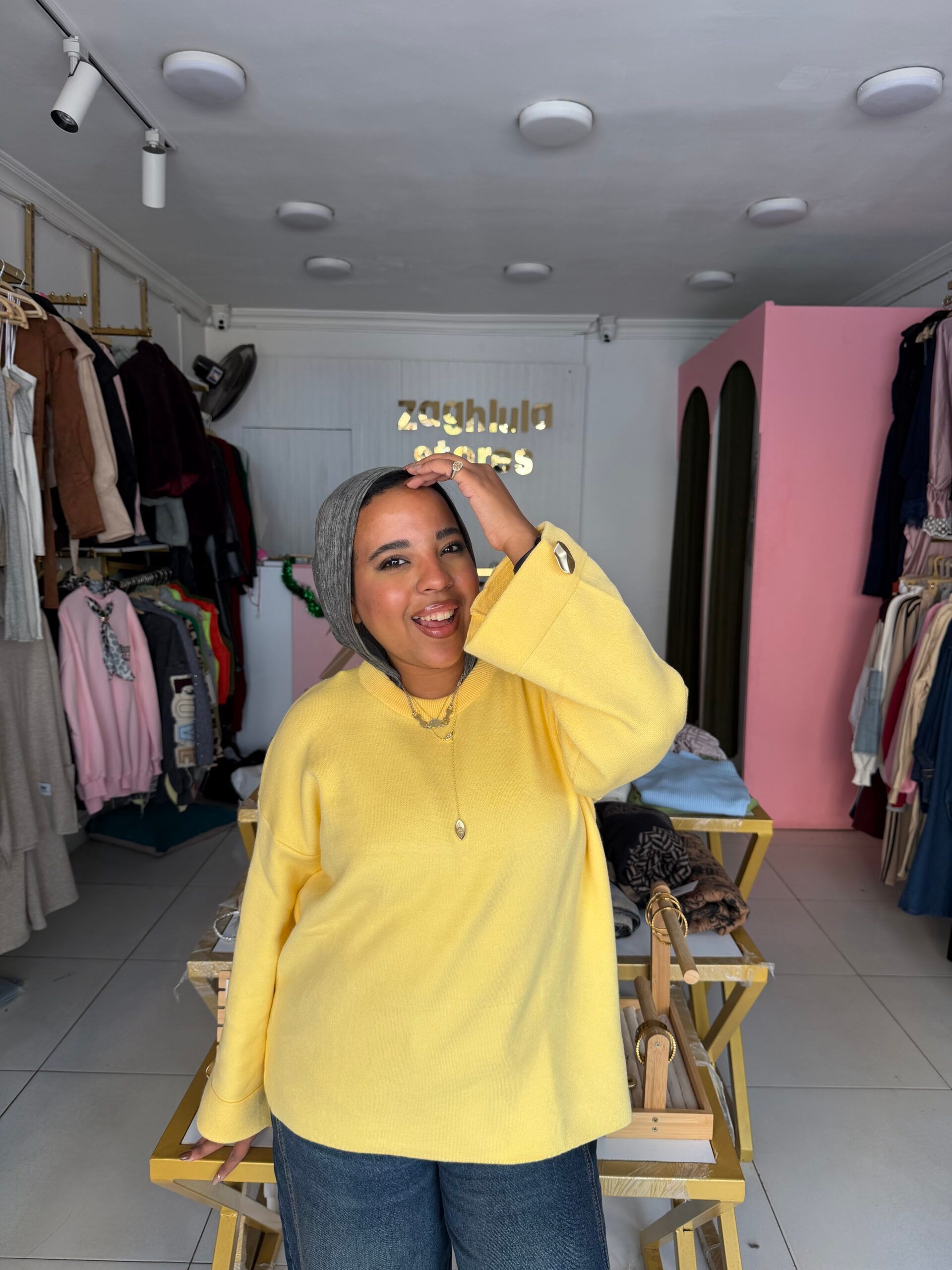 Pullover with button on sleeve